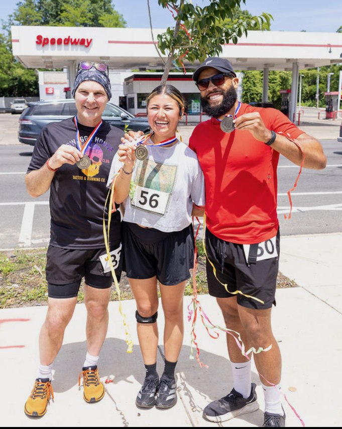 Diana Sparkles celebrating with friends after a race, holding medals